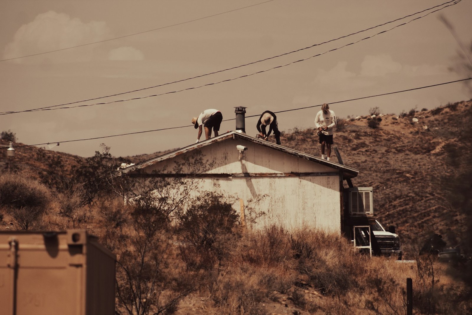 A group of people working a roof together